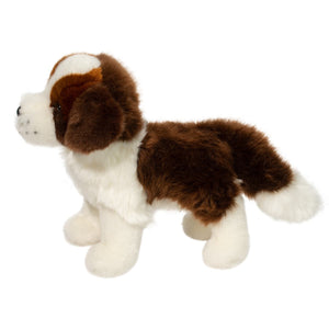 Plush toy dog with brown and white fur on a white background