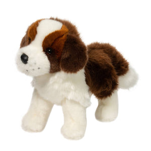 Plush toy dog with brown and white fur on a white background