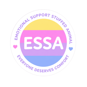 A circular sticker or graphic with the text 'EMOTIONAL SUPPORT STUFFED ANIMAL' and 'EVERYONE DESERVES COMFORT' around a central ESSA logo. The center features the pansexual pride flag colors in yellow, pink, purple, and blue, with small pink and blue hearts on the left and right.