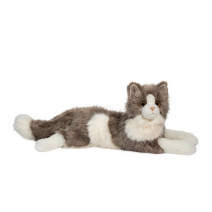 Plush toy cat lying on a white background