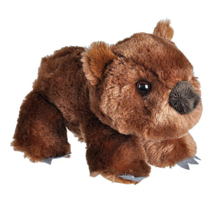 A brown plush toy wombat with soft fur, black eyes, a black nose, and small gray claws, photographed on a plain white background.