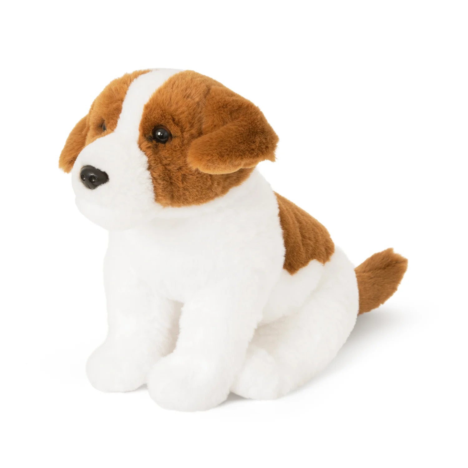 Plush toy dog with brown and white fur on a white background