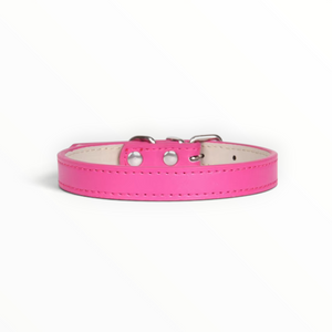 A Dark Pink leather dog collar with silver metal hardware and white stitching, shown against a plain white background.