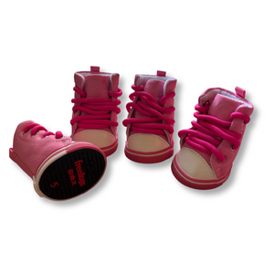 Set of pink high-top sneakers on a white background