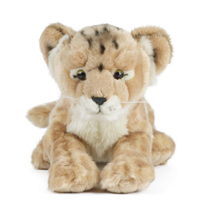Plush toy lion lying down on a white background