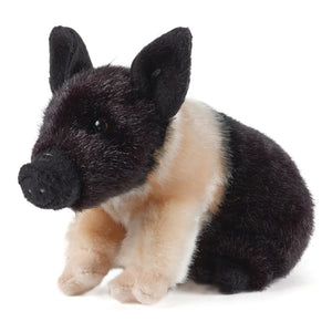 Plush toy pig with black and brown fur on a white background