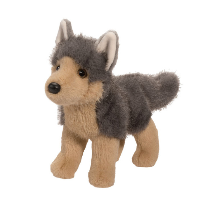 A plush toy dog with a gray and tan fur pattern, standing on a plain white background.