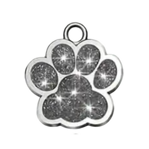 Silver paw print charm with embedded crystals on a white background