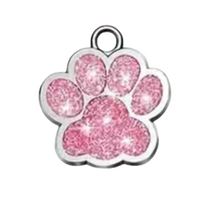 Pink glittery paw print charm on a white background