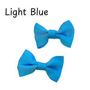 Two light blue bow ties on a white background with 'Light Blue' text above.