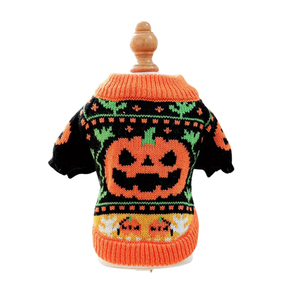 A small knit Halloween sweater displayed on a wooden mannequin torso against a plain white background. The sweater is primarily black with a bright orange crew neck, cuffs, and hem, featuring a large orange jack-o'-lantern face in the center and green and orange decorative patterns.
