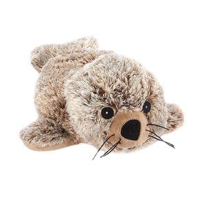 A plush toy seal lying down, made of shaggy brown and beige faux fur with a tan snout, black eyes, and black whiskers, photographed on a solid white background.
