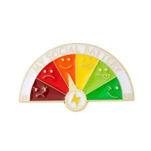 Enamel pin with a social battery gauge featuring smiley faces and a yellow lightning bolt on a white background.