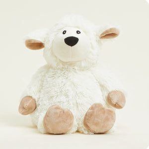 White plush lamb toy with brown feet on a white background