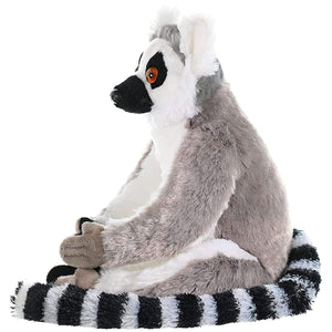 Plush toy of a lemur with a white face and black and white striped tail on a white background