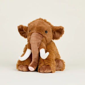 Brown plush elephant toy on a light beige background