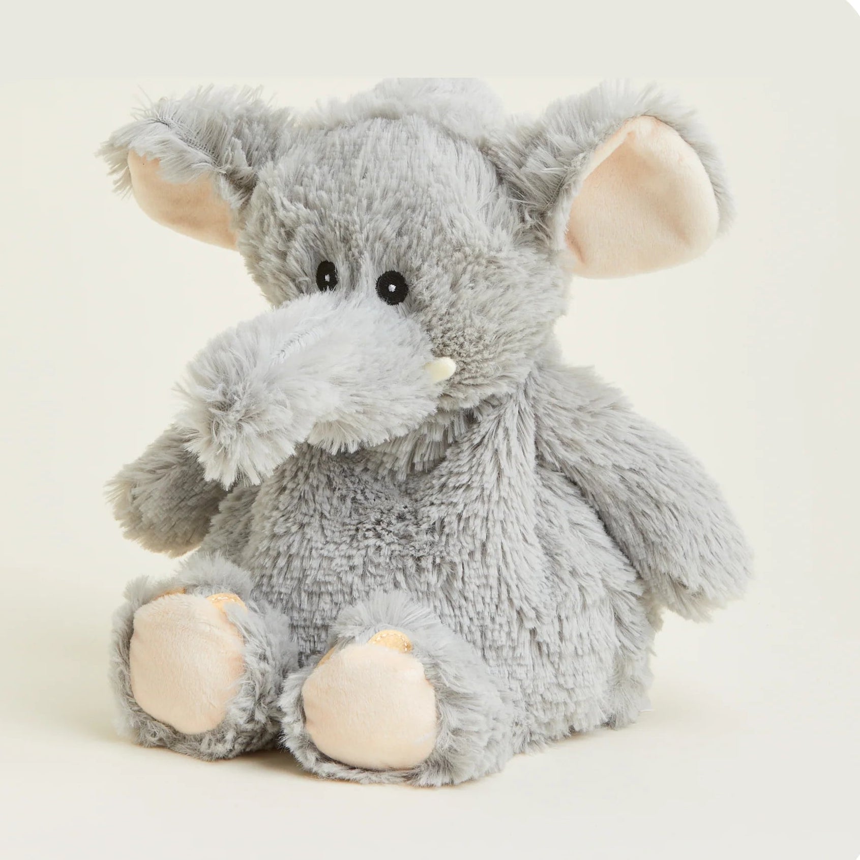 Plush elephant toy on a light background