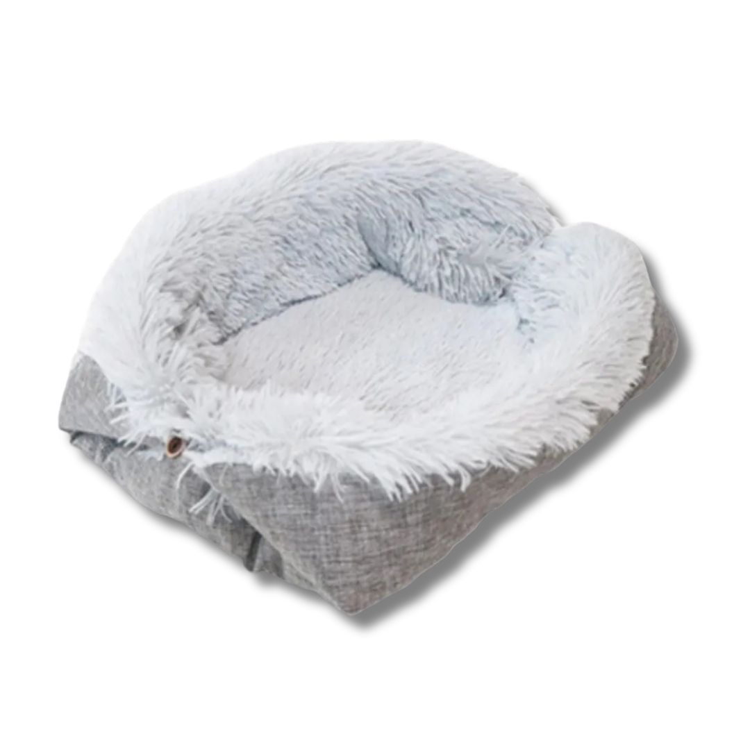 Gray and white fluffy pet bed on a white background