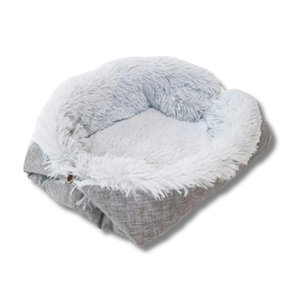 Gray and white fluffy pet bed on a white background