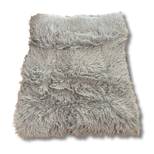 Gray fluffy pet bed on a white background