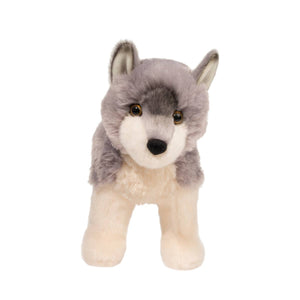 Plush toy wolf on a white background