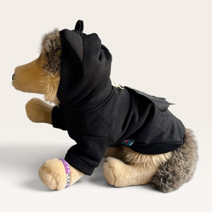 Black Hoodie for pet with bat wings for halloween on a plushie dog on a white backgorund.