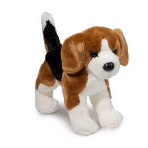 Plush toy dog with brown, white, and black fur on a white background