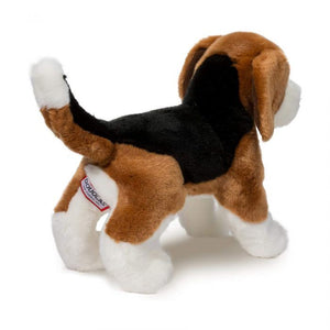 Plush toy dog with a visible brand tag on a white background
