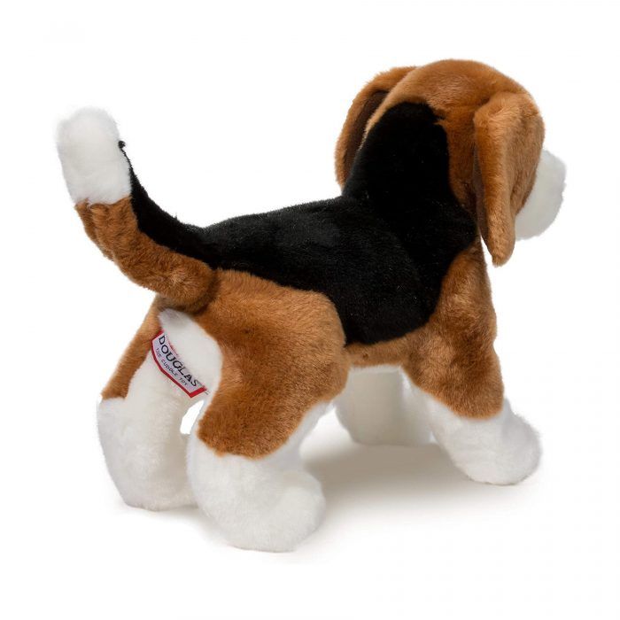 Plush toy dog with a visible brand tag on a white background
