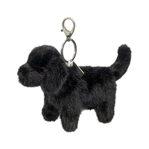 Black dog-shaped keychain on a white background