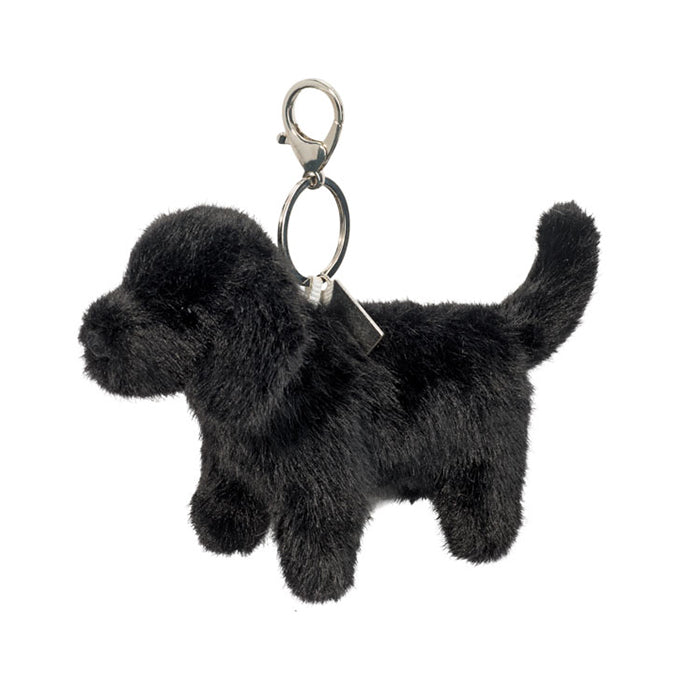 Black dog-shaped keychain on a white background