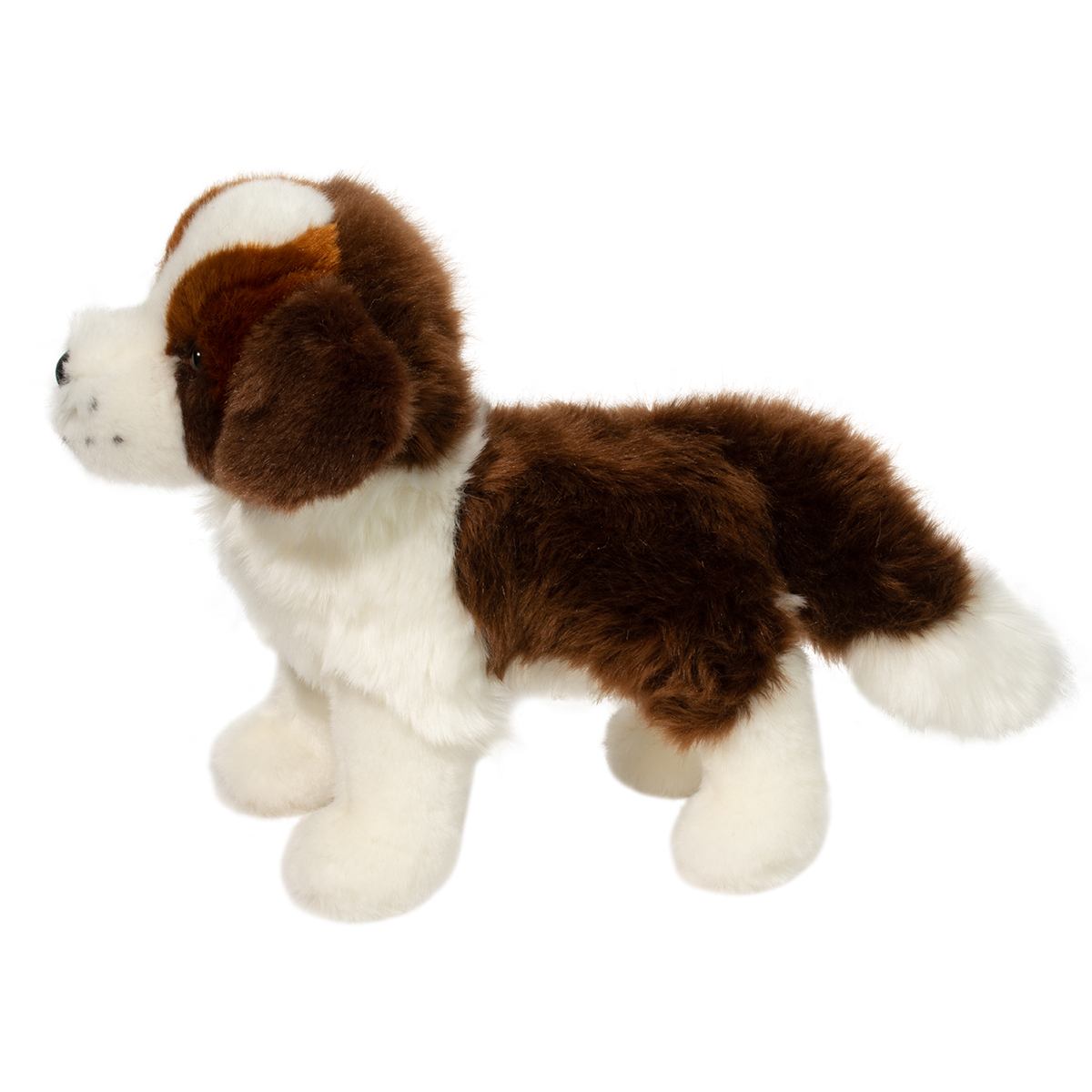 Plush toy dog with brown and white fur on a white background