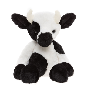 Plush cow toy with black and white pattern on a white background