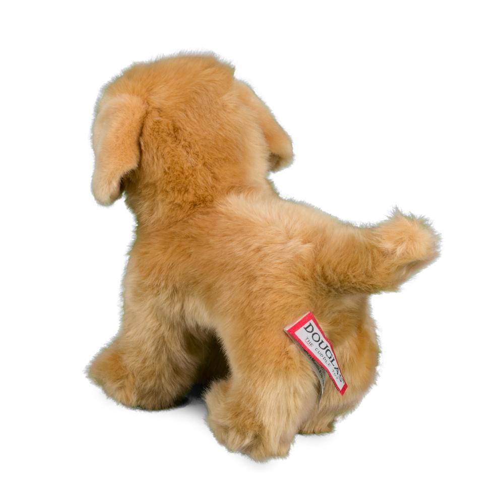 Plush dog toy with a visible brand label on a white background