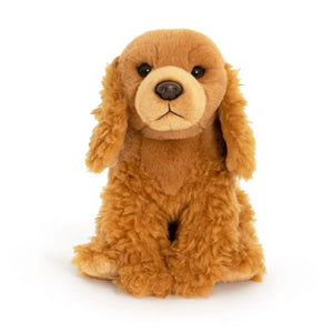 Brown plush dog toy on a white background
