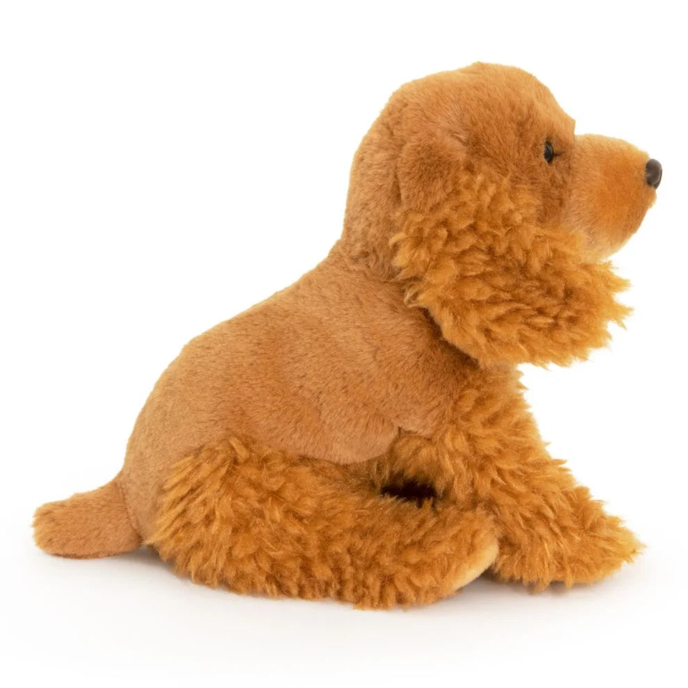 Brown plush dog toy on a white background