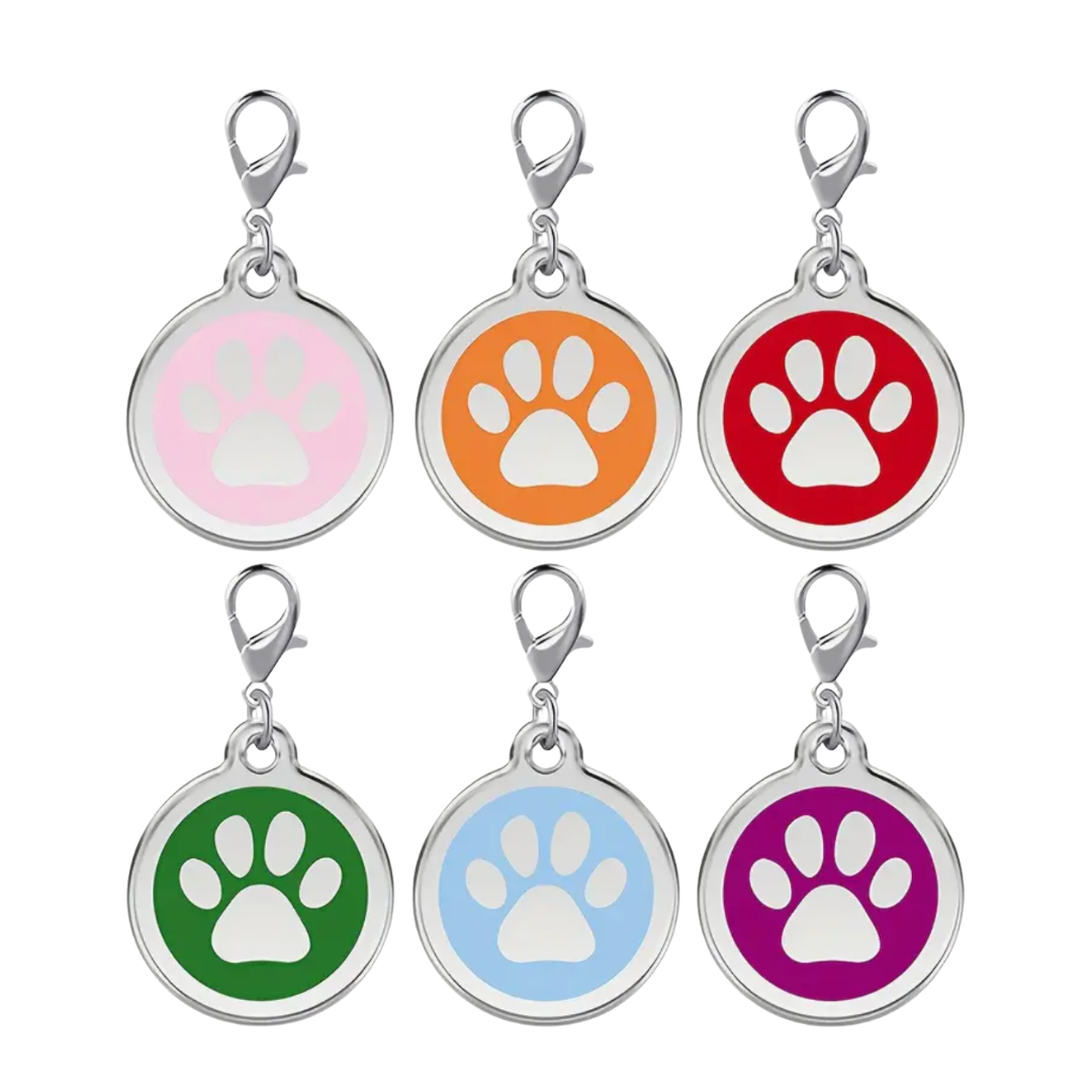 Set of six colorful pet tags with paw prints on a white background