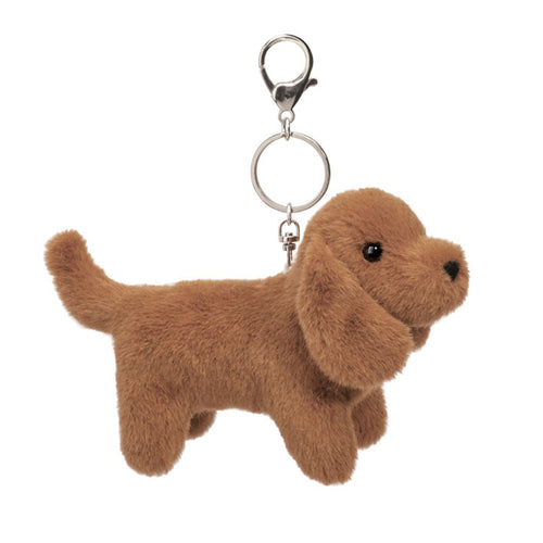 Brown dog-shaped keychain on a white background