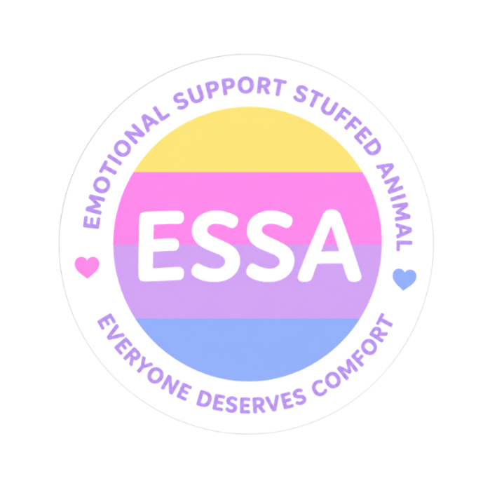 A circular sticker or graphic with the text 'EMOTIONAL SUPPORT STUFFED ANIMAL' and 'EVERYONE DESERVES COMFORT' around a central ESSA logo. The center features the pansexual pride flag colors in yellow, pink, purple, and blue, with small pink and blue hearts on the left and right.