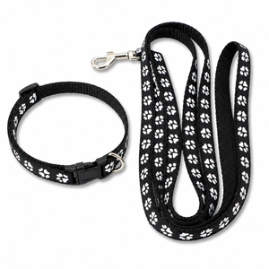 A black pet collar and matching leash set with a repeating white paw print pattern, shown on a clean white background.
