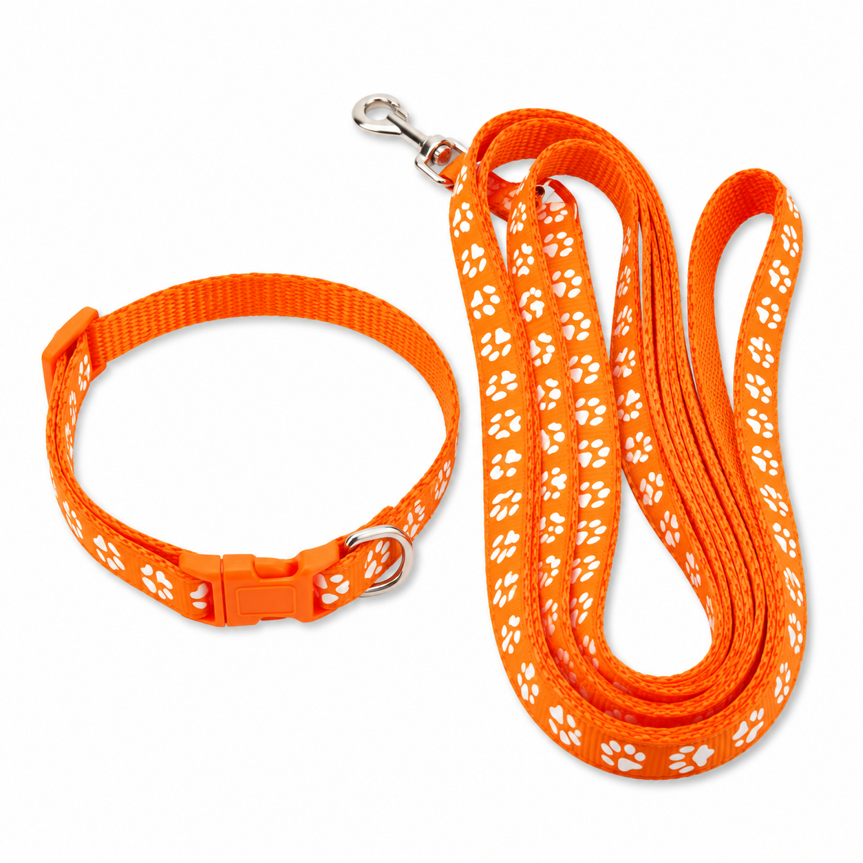 An orange pet collar and matching leash set with white paw print patterns and silver metal hardware, shown on a plain white background.