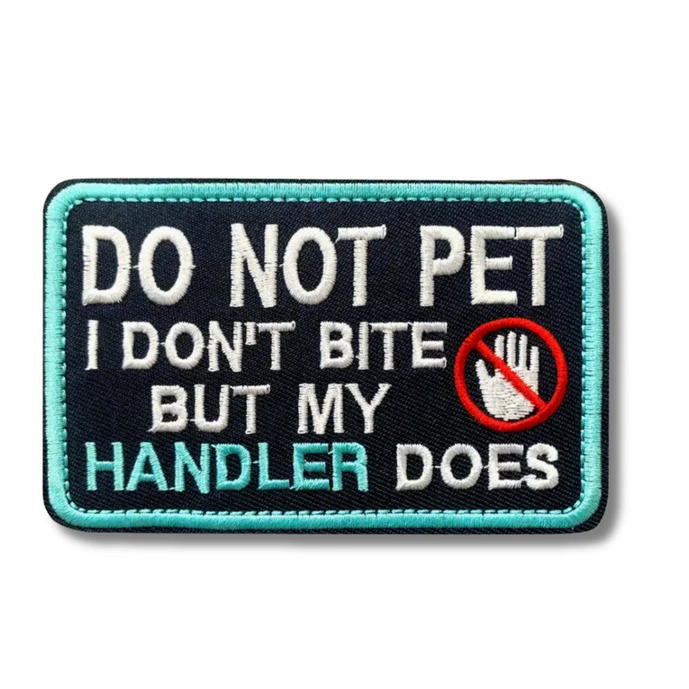 Embroidered patch with text 'Do not pet, I don't bite but my handler does' on a black background.