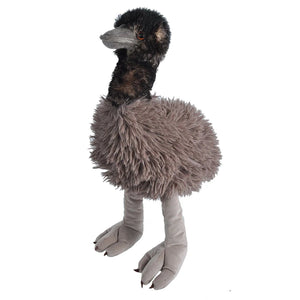 A plush ostrich toy with black and brown feathers on its head and neck, a fluffy gray-brown body, and long gray legs and feet, photographed against a plain white background.
