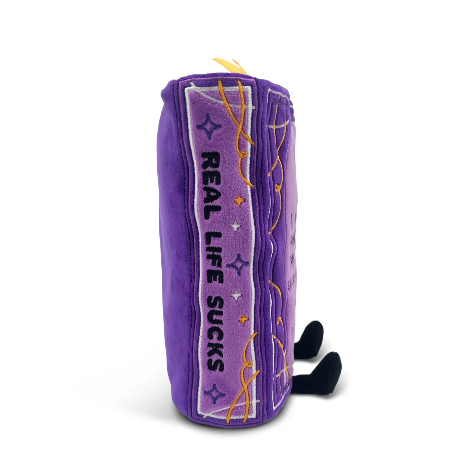 Purple plush toy with 'Real Life Sucks' text on a white background