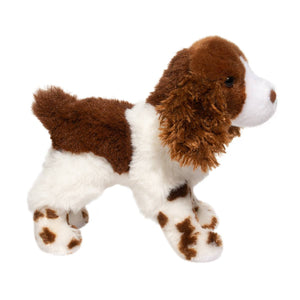 Plush toy dog with brown and white fur on a white background
