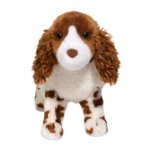 Plush toy dog with brown and white fur on a white background