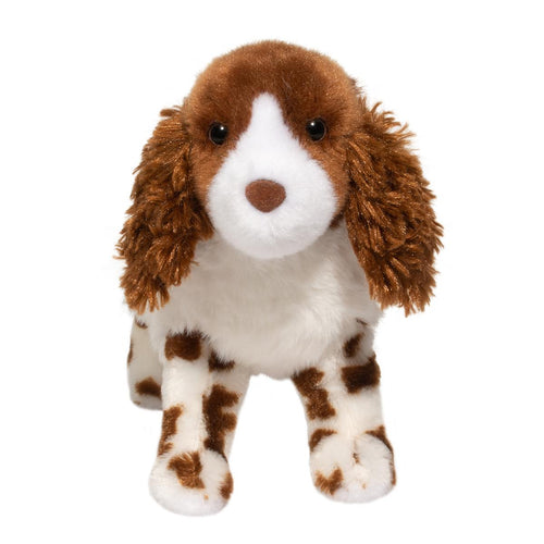 Plush toy dog with brown and white fur on a white background
