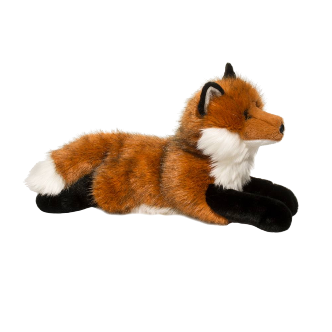Plush toy fox lying on a white background