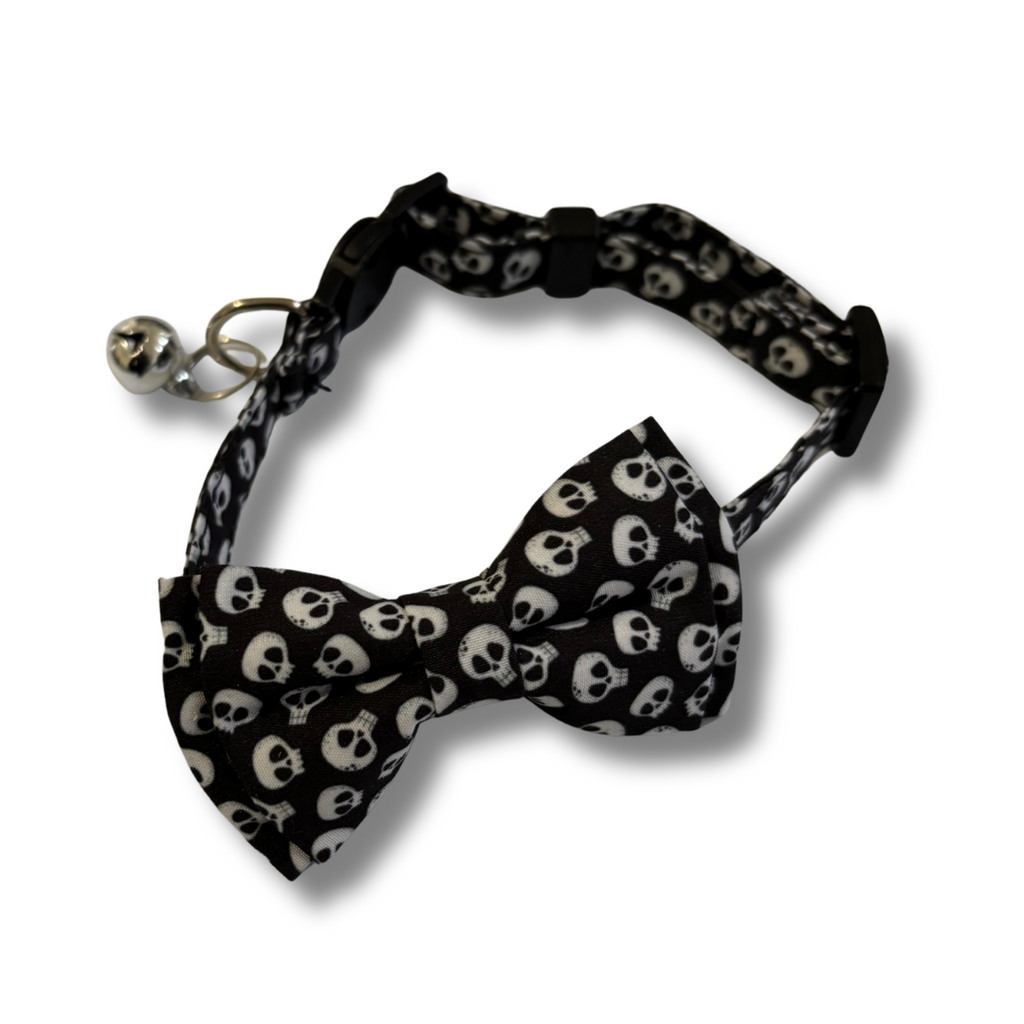 Black bow tie with white skull pattern on a white background