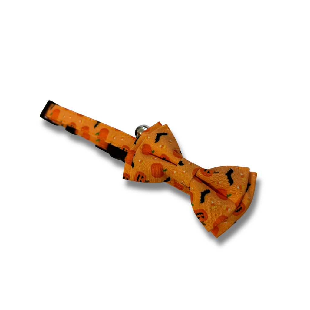 Orange bow tie with black patterns on a white background